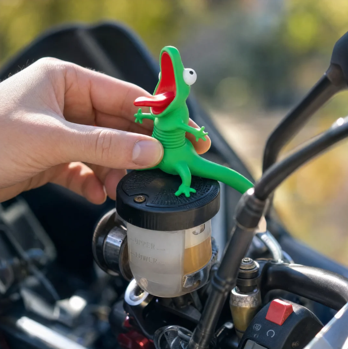 Green MotoPal Lizard figurine with open mouth mounted on a motorcycle