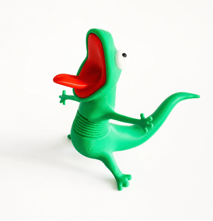 Green MotoPal Lizard figurine with red tongue on a white background